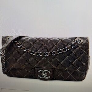 Authentic Chanel iridescent caviar quilted small chic flap in brown.